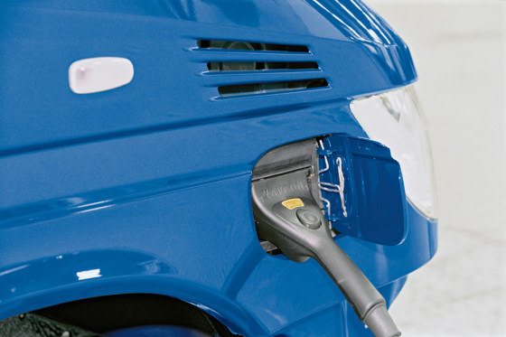 DaimlerChrysler is experimenting with plug-in hybrids on some of its Sprinter commercial vans. The front right body panel contains an outlet to recharge the van's extra battery pack.