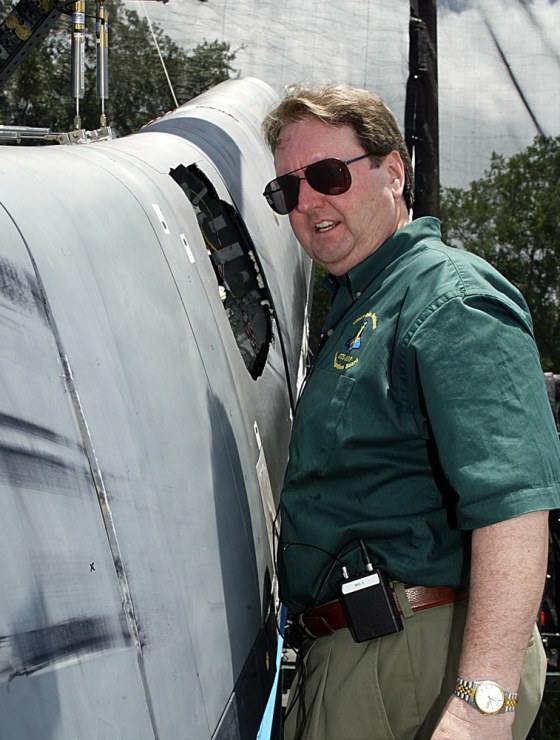 G. Scott Hubbard, the Ames Research Center director who is leaving NASA for a new job at the SETI Institute, is shown here inspecting a reinforced carbon-carbon panel after a test conducted in 2003 as part of the Columbia accident investigation.