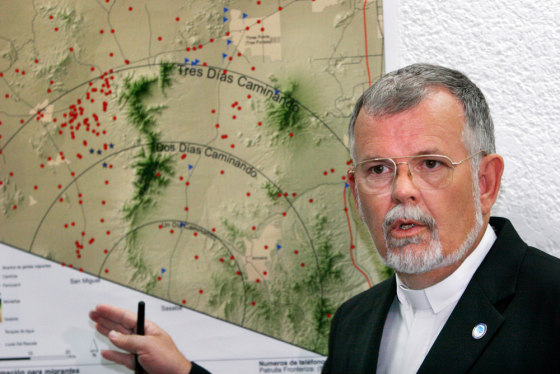 The Rev. Robin Hoover, president of the U.S.-based Humane Borders group, shows migrant deaths (red dots) in the Arizona desert during a Mexico City news conference Tuesday with Mexico's National Commission for Human Rights. The commission will post signs and distribute maps to migrants that were produced by Humane Borders.