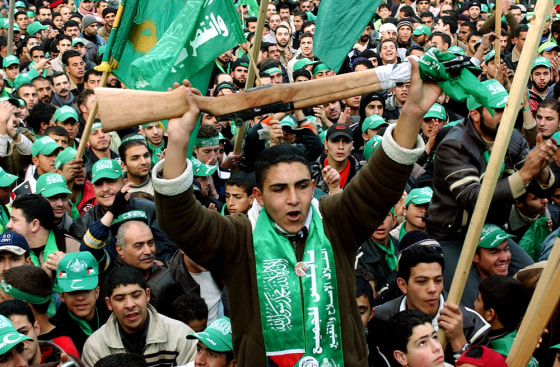Palestinian Hamas supporters celebrate their landslide victory in parliamentary elections in the West Bank City of Nablus on Thursday.