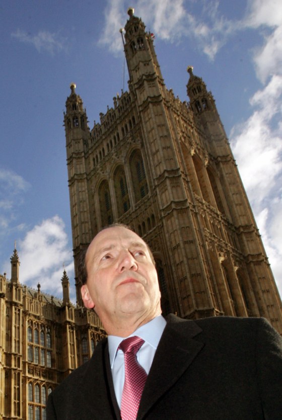 British Liberal Democrat MP Hughes walks to Houses of Parliament in Westminster, central London