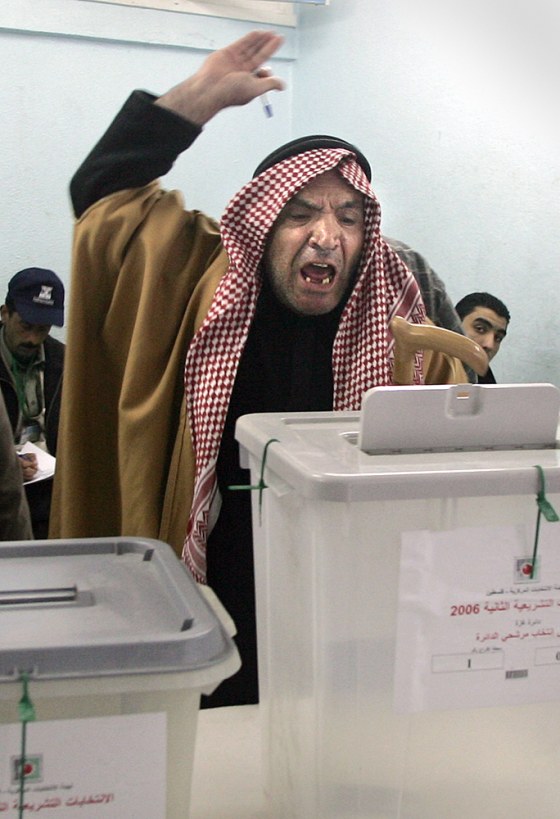 A Palestinian man shouts after casting h