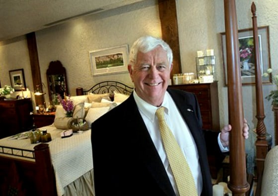 Artist and designer Bob Timberlake stands with some of his signature furniture line at his gallery in Lexington, N.C. last month. Timberlake has been an outspoken critic of companies that have moved furniture production overseas. 