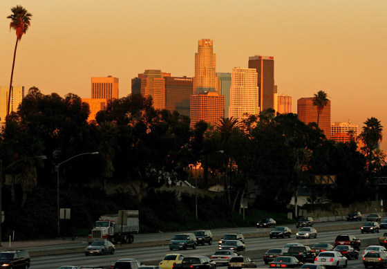 Traffic passes downtown Los Angeles on the 10 freeway