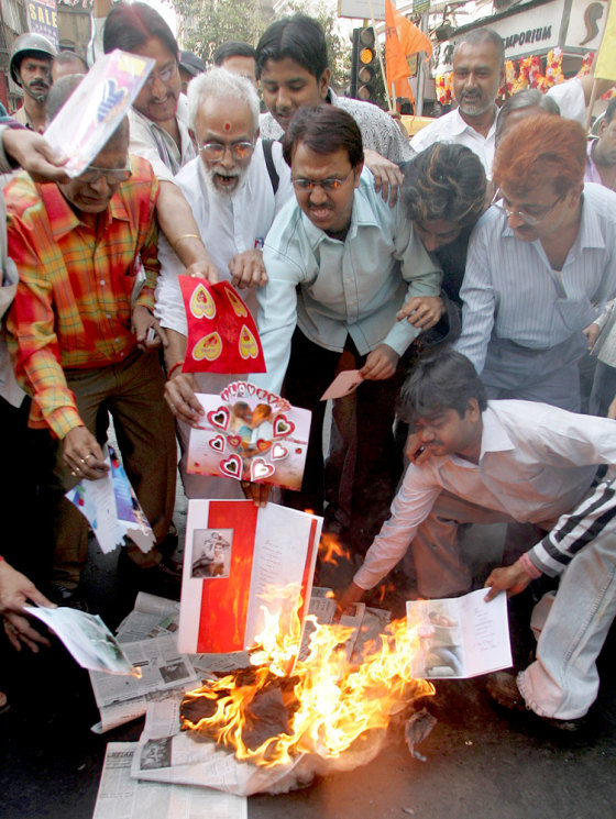 Activists from the hardline Hindu group Shiv Sena burn Valentine's Day cards in Kolkata