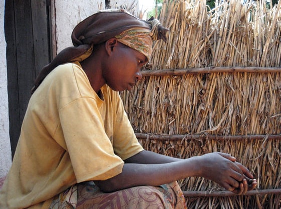 Jeanviere Nzamwitakuze, 31, widow of one of more than 100 genocide criminals who have killed themselves rather than face court.
