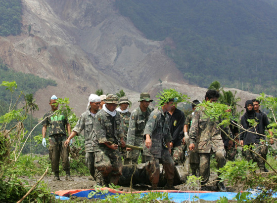 SOLDIERS CARRY LANDSLIDE VICTIM
