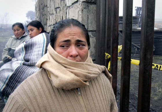 Relatives of trapped miners wait outside the main gate of the Pasta de Conchas No. 8 coal mine in San Juan de Sabinas, Mexico, on Tuesday.