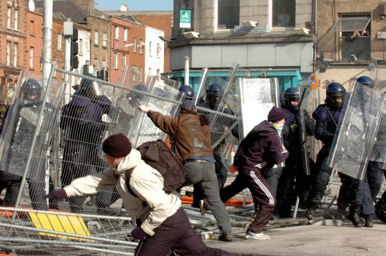 Hundreds of Irish Republican Army supporters clashed with police on Dublin's central boulevard Saturday in a bid to block an unprecedented Protestant parade from passing through the capital.
