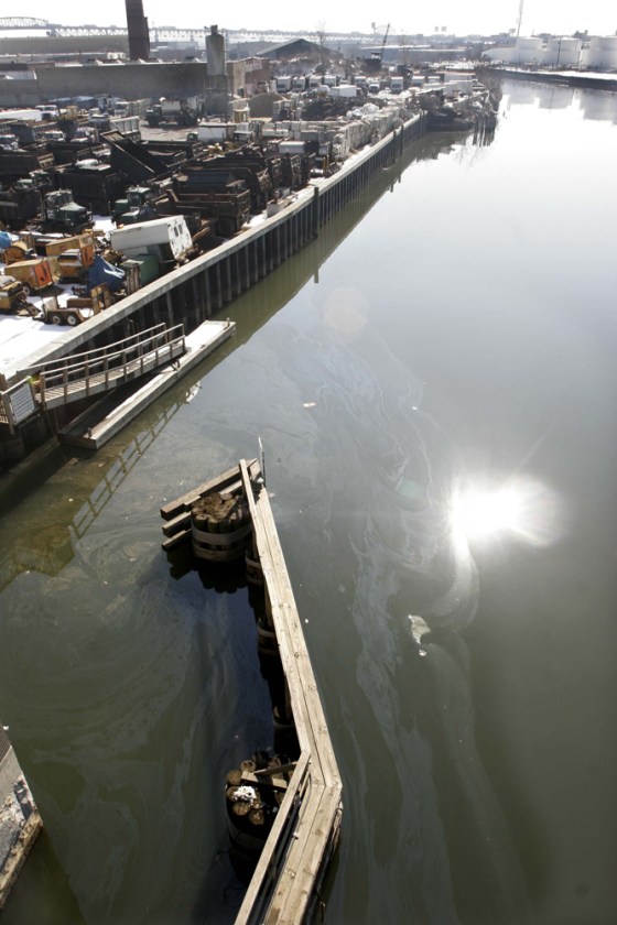 An oil sheen swirls atop Newton Creek in the Greenpoint section of Brooklyn, New York, last Feb. 16. Some local residents have sued Exxon, Chevron and BP to force the expedited cleanup of an estimated 17-million-barrel underground oil spill containing more petroleum than the Exxon Valdez dumped off Alaska.
