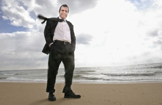Mark Rogers, communication director for Cape Wind stands on a Cape Cod, Mass. beach overlooking the patch of water some 6.5 miles away where his group wants to build a 130-turbine wind farm. A Congressional subcommittee is considering a measure restircting such turbines that could kill the project.