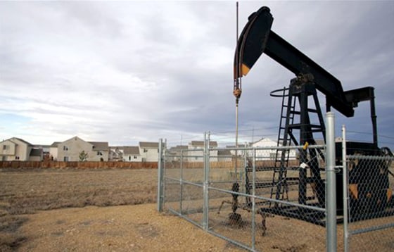 Energy companies are snapping up land along the Rockies, including this plot next to homes in Frederick, Colo.