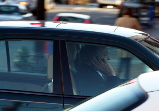 A man illegally talks on a cell phone while driving on M Street in Washington, D.C.