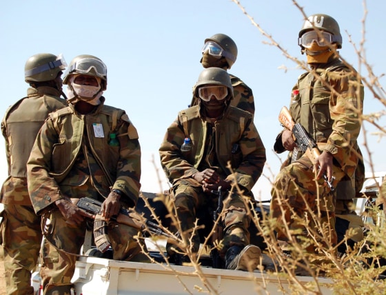 Africa Union peacekeepers patrol during visit by former UN force commander Dallaire to Sudan's Darfur region