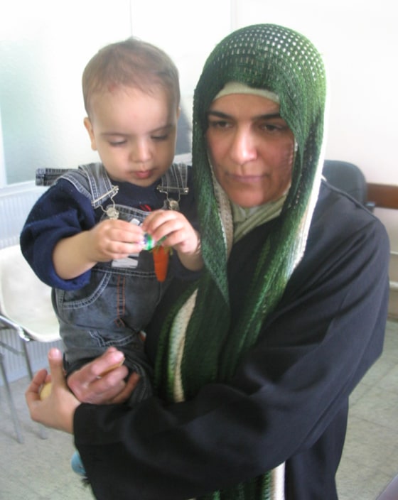 Khadija Murad and her year-old son Hussein. Murad is a patient at a psychiatric outreach center at Baghdad's Yarmouk Hospital, where these photos were taken.