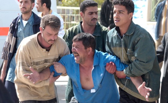 A man mourns the death of a relative who died in a car bomb explosion in Baqouba on Monday.