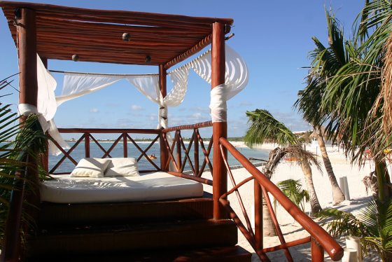 Lounge pavilions line the beach at the El Dorado Seaside Suites resort on the Riviera Maya in Mexico.