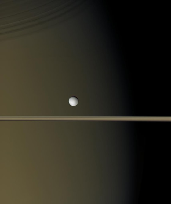 Enceladus shines as a bright pearl against the backdrop of Saturn and its rings in this image taken by the Cassini spacecraft in January. The tiny moon is just 505 kilometers (314 miles) across.