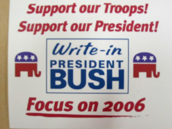 Posters, like this one, and lapel buttons supporting President Bush are being distributed around the Southern Republican Leadership Conference today in Memphis.