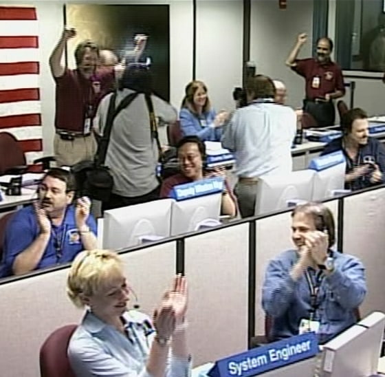 Controllers at NASA's Jet Propulsion Laboratory in Pasadena, Calif., cheer on Friday after hearing that Mars Reconnaissance Orbiter successfully made it into orbit around the Red Planet.