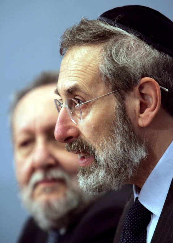 Rome's chief Rabbi Riccardo Di Segni, right, flanked by Mario Scialoja, president of the Muslim World League in Italy, delivers a speech on Monday.