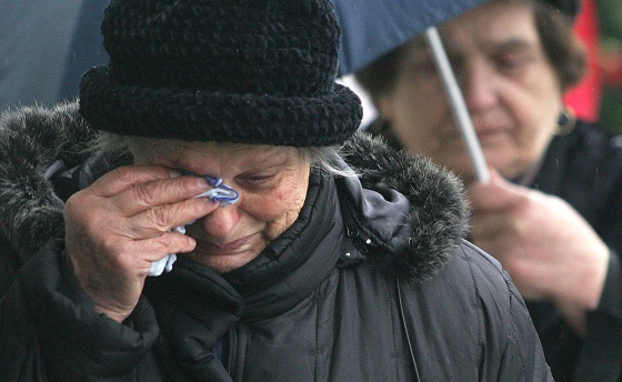 A woman wipes tears after paying tribute to the late Serbian and Yugoslav president Slobodan Milosevic in Belgrade on Monday.