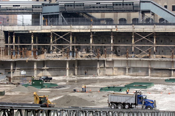 Workers stand at Ground Zero 13 March 20
