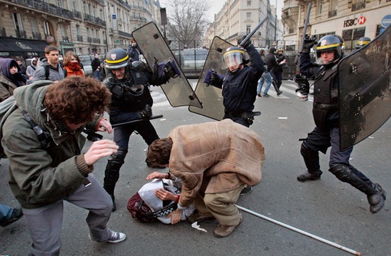 Protesters clash thursday with riot police officers in Paris after a student protest against the First Job Contract, known as CPE, a new labor law. The government tried to maintain a united front for this pivotal test of the country's future direction.