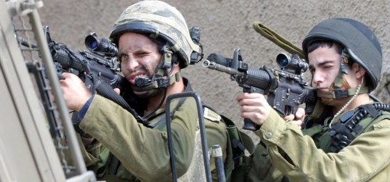 Israeli soldiers aim their rifles in Jenin