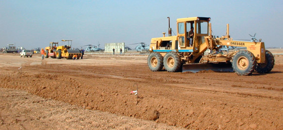 Turkish contractors grade a parking ramp for the U.S. aircraft's Balad air base, 40 miles north of Baghdad, earlier this month.