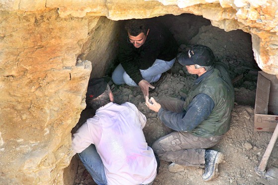 People work in the ancient tomb in Kouklia village near the coastal town of Paphos, Cyprus, where the white-stone sarcophagus was found.