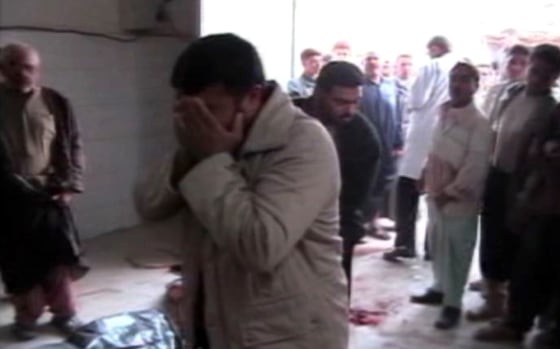 This image taken from a videotape made by a journalism student and obtained by Time magazine shows a scene in what appears to be a morgue following an alleged fatal raid by U.S. forces Nov. 19, 2005, in Haditha, Iraq.