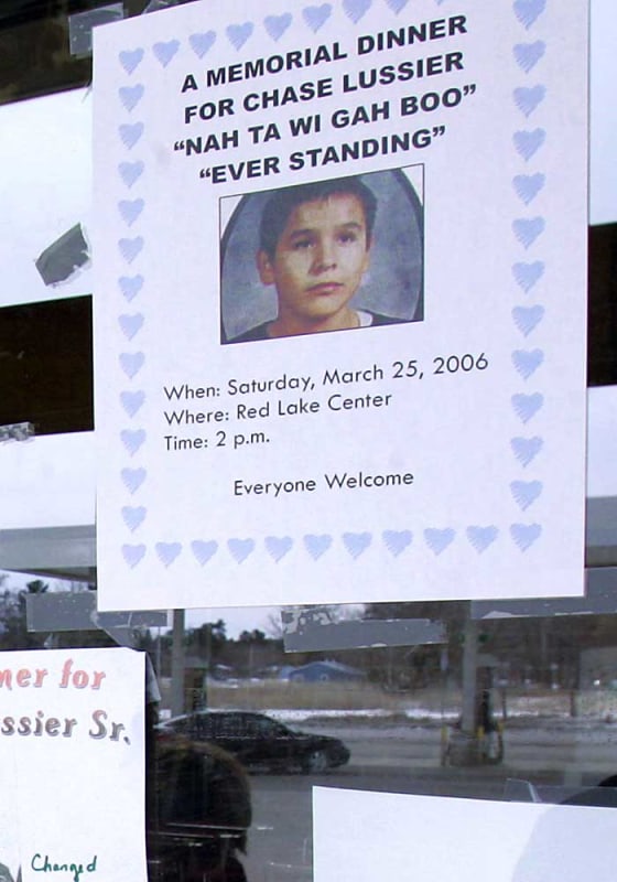 A flyer posted at a Red Lake, Minn., grocery store on Monday announces a memorial dinner for Chase Lussier, one of five students shot and killed by a fellow student last March 21 at Red Lake High School.