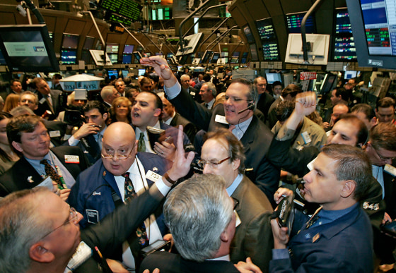 Traders crowd the post on the floor of the New York Stock Exchange as Canadian coffee and doughnut chain Tim Hortons Inc. has its initial public offering Friday.
