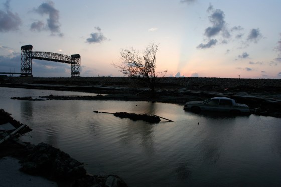 The broken Industrial Levee located near the N. Claiborne drawbridge in New Orleans’ Ninth Ward is seen at sunset on Oct. 3, 2005.