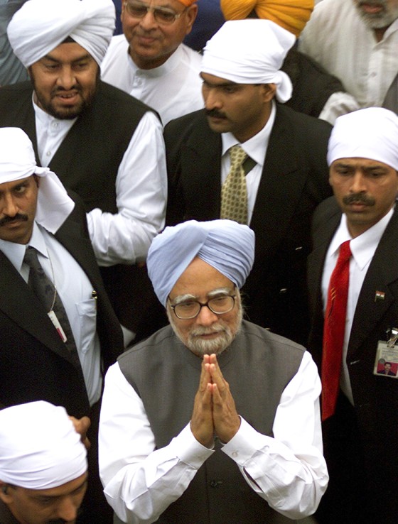 Indian Prime Minister Singh gestures after visiting holy Sikh shrine in Amritsar