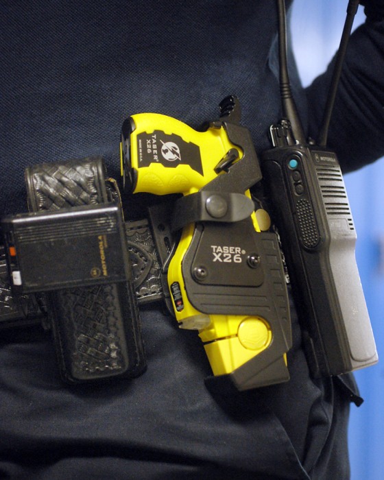 Taser guns, such as this one shown on St. Paul, Minn., police officer Julie Maidment, are legal in 43 states.