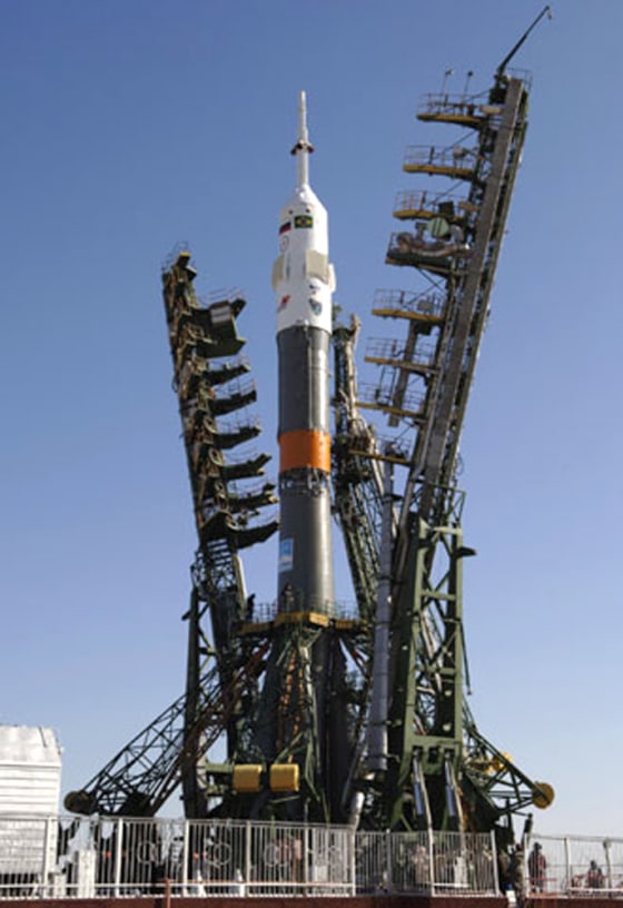 A Soyuz rocket stands ready at the launch pad at Russia's Baikonur Cosmodrome in Kazakhstan, awaiting final preparations for launch on Wednesday. The rocket is to send three astronauts to the international space station.