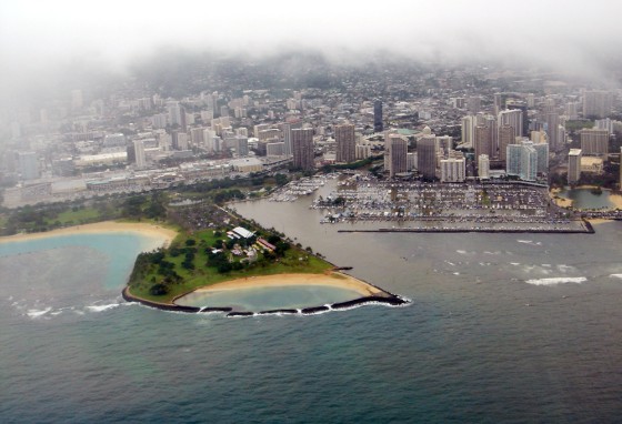 Water darkened by raw sewage pours out of the Ala Wai Canal and harbor area in Honolulu on Wednesday. 