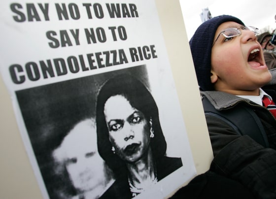Protester chants anti-war slogans outside Pleckgate High school as US Secretary of State Rice visits Blackburn