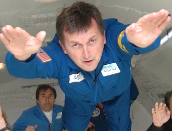 Software billionaire Charles Simonyi, shown here doing a "Superman" act during a zero-gravity airplane flight, has signed up for a multimillion-dollar trip to the international space station.