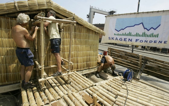 Norwegian explorers work on a wooden raft in the port of Callao in Lima, Peru, on Wednesday. The raft, named "Tangaroa" after the Polynesian god of the ocean, is being prepared for a 5,000-mile Pacific odyssey.