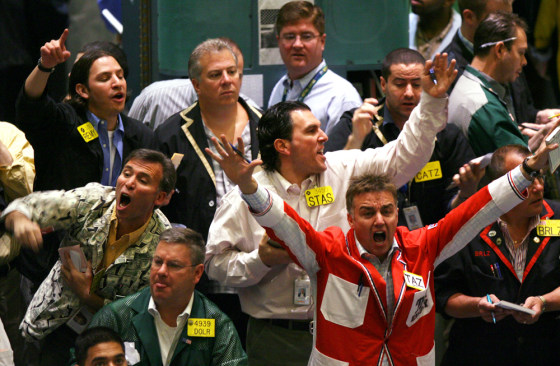 Traders work in the crude oil futures pit of the New York Mercantile Exchange this week as oil prices hit a record high.