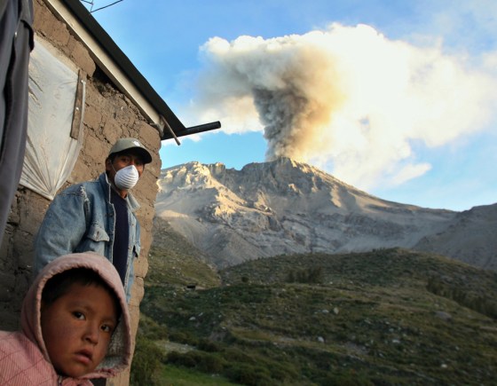 Local resident wears mask to protect himself from ashes spewing from Peru's volcano Ubinas in Querapi