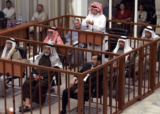 Co-defendant of former Iraqi President Saddam Hussein speaks during their trial in Baghdad's Green Zone