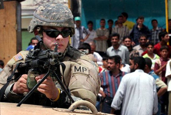 A U.S. military policeman secures the scene of a bomb explosion in Sadr City on Tuesday.