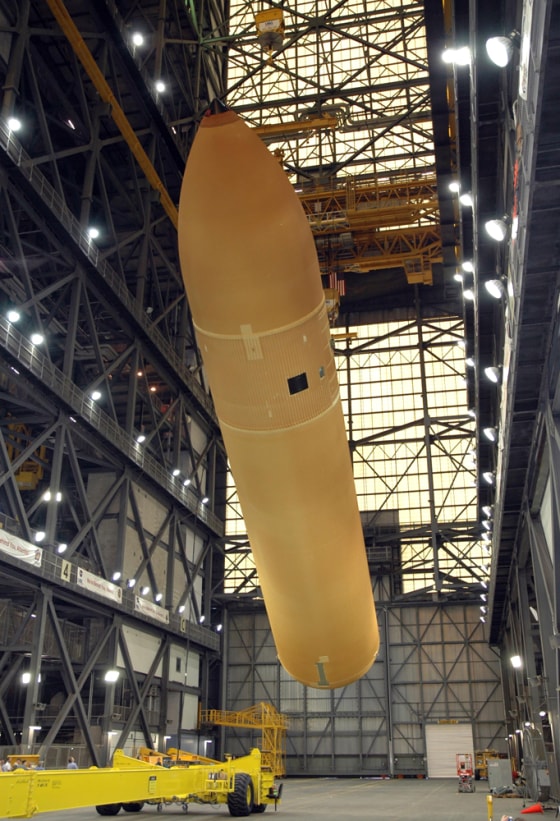 The external fuel tank, seen earlier this year at the Kennedy Space Center's Vehicle Assembly Building, has already had several changes made to it since last year's space shuttle flight.