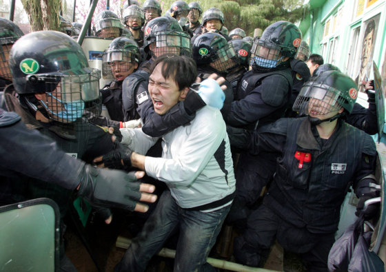 Riot policemen suppress residents and activists at a village near U.S. military bases in Pyongtaek