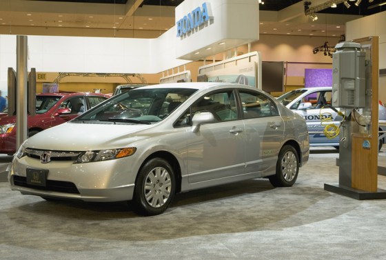 A 2006 Honda Civic GX sits next to a natural gas refueling appliance known as "Phill."