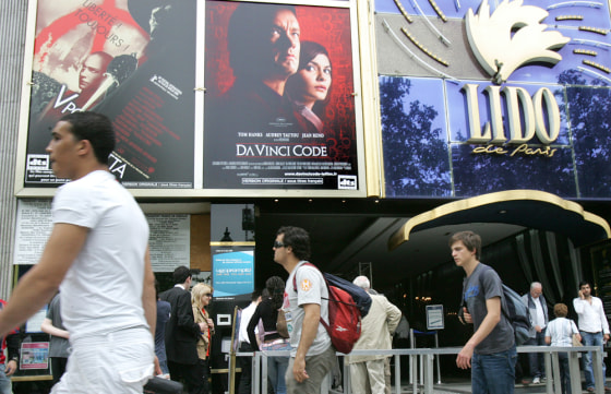 A theater on the Champs-Elysees plays up its screening of "The Da Vinci Code" on Wednesday.